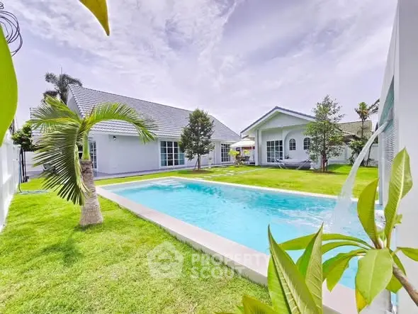 Stunning modern home with private pool and lush garden, perfect for luxury living.