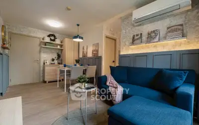 Stylish modern living room with blue sofa and elegant decor