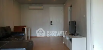 Spacious living room with modern furniture and air conditioning in a stylish apartment.