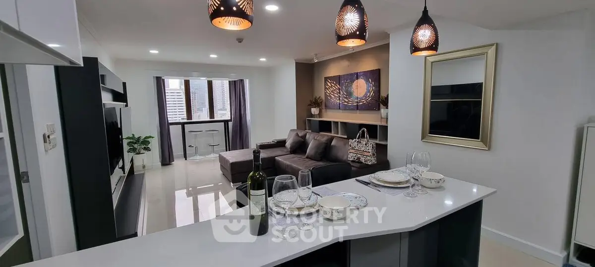 Modern open-layout living room with stylish decor and city view