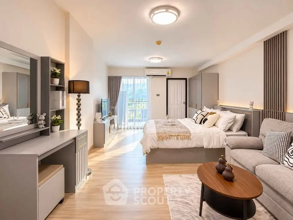 Spacious modern bedroom with stylish decor and natural light