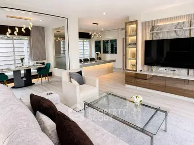 Luxurious modern living room with elegant decor and spacious dining area, perfect for entertaining.