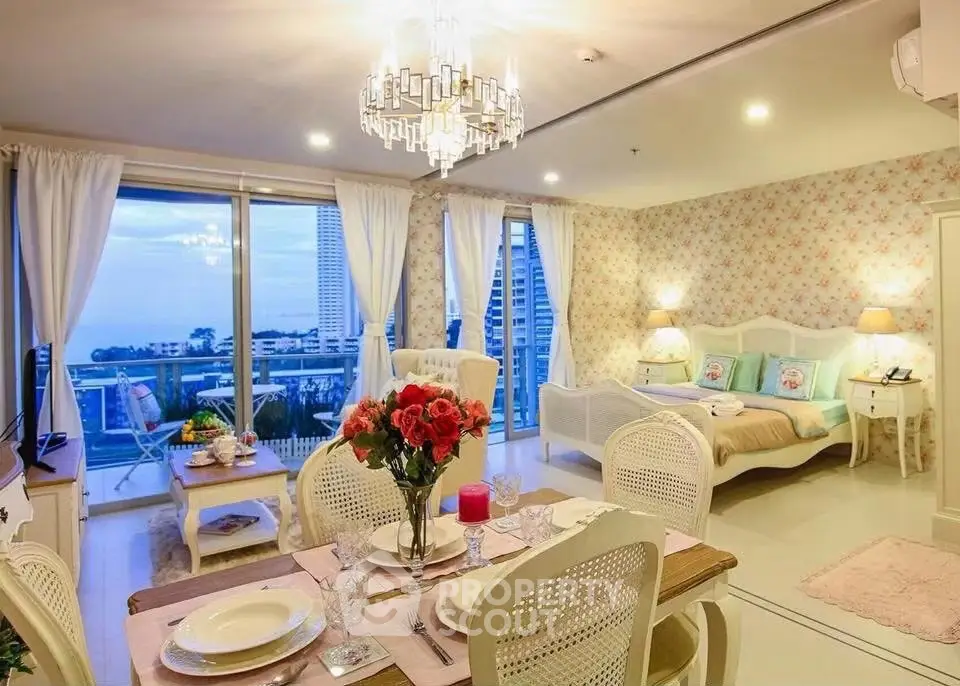 Luxurious open-plan living room with elegant dining area and stunning balcony view