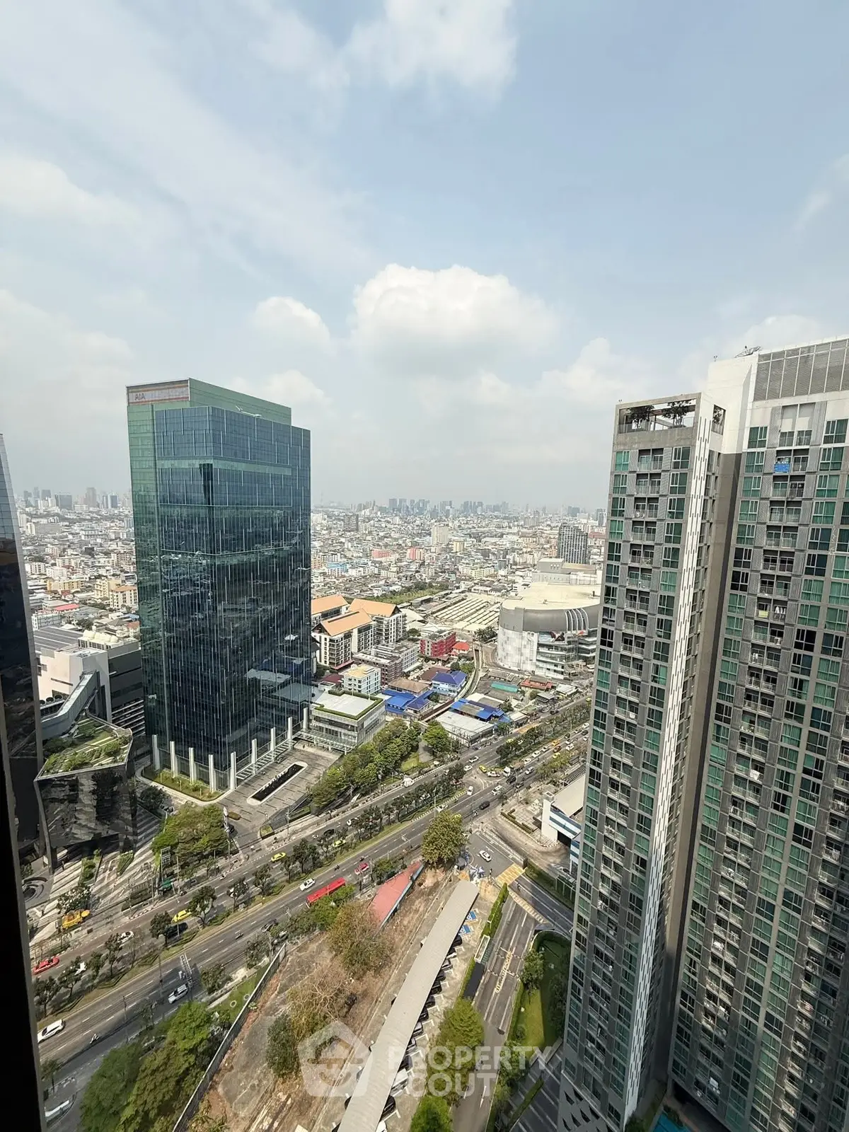 Stunning cityscape view from high-rise building showcasing urban skyline and modern architecture.