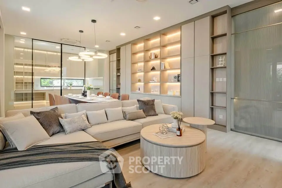 Luxurious modern living room with elegant decor and spacious seating area, perfect for relaxation and entertainment.