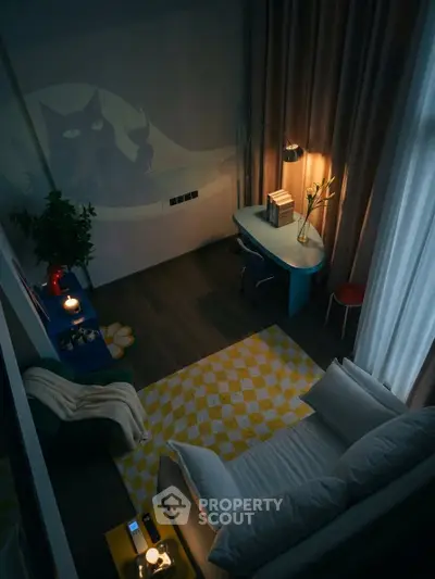 Cozy living room with modern decor and ambient lighting, featuring a stylish workspace and comfortable seating.