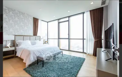 Luxurious modern bedroom with floor-to-ceiling windows and elegant decor