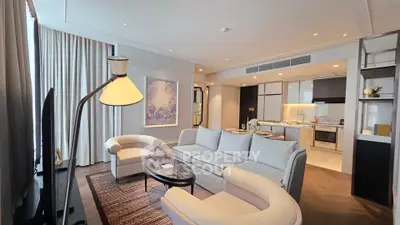 Luxurious modern living room with elegant furniture and open kitchen layout, perfect for stylish urban living.