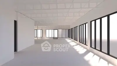 Spacious open-plan interior with large windows and abundant natural light, perfect for modern office or loft conversion.