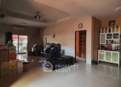 Spacious living room with modern furniture and ample natural light