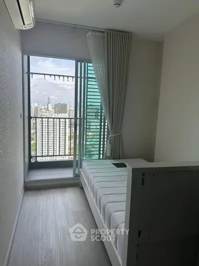 Modern bedroom with balcony offering stunning city view