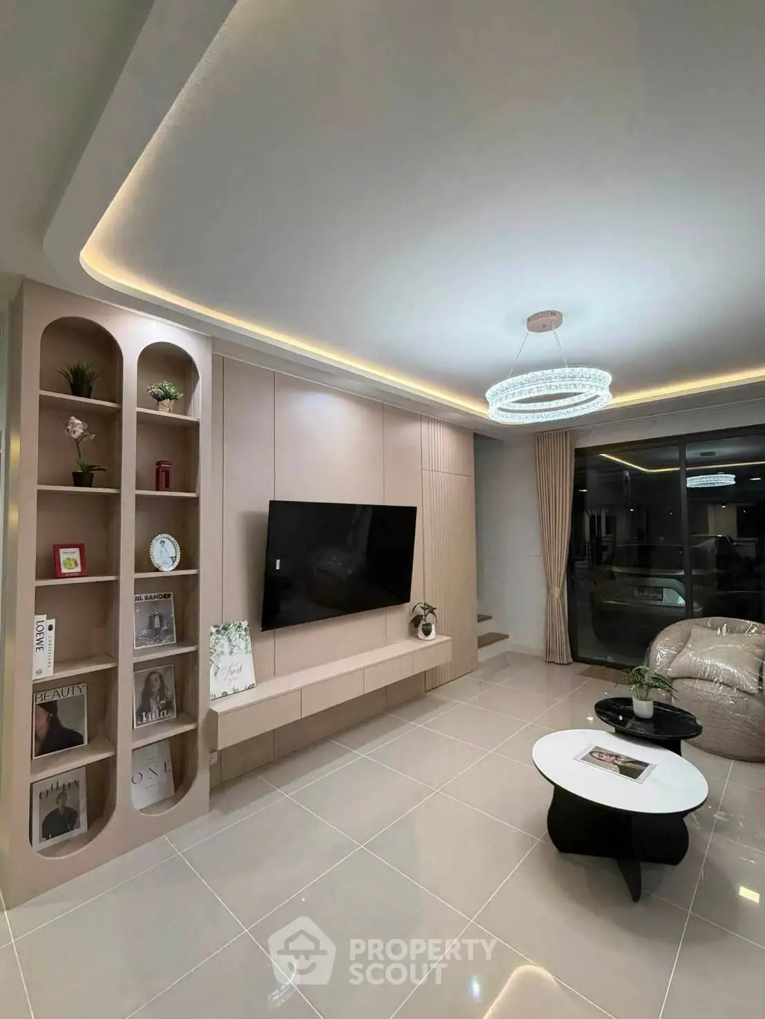 Luxurious modern living room with elegant lighting and sleek TV setup, perfect for stylish urban living.