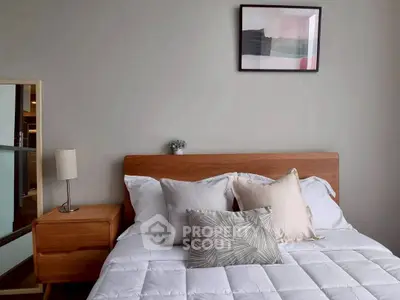 Cozy bedroom with modern decor and stylish wooden furniture, perfect for relaxation and comfort.