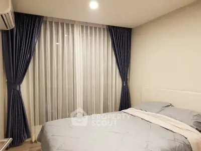 Cozy bedroom with elegant blue curtains and soft lighting