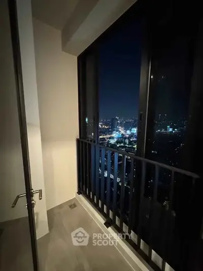 Stunning night city view from a modern high-rise balcony, perfect for urban living.