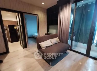 Modern apartment interior with cozy living area and balcony access