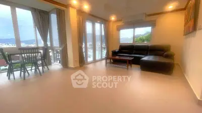 Spacious living room with panoramic windows and modern furniture