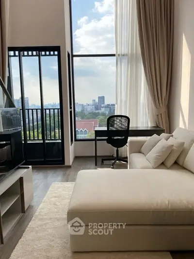 Luxurious living room with floor-to-ceiling windows and stunning city view