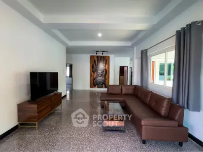 Spacious living room with modern decor and large sectional sofa
