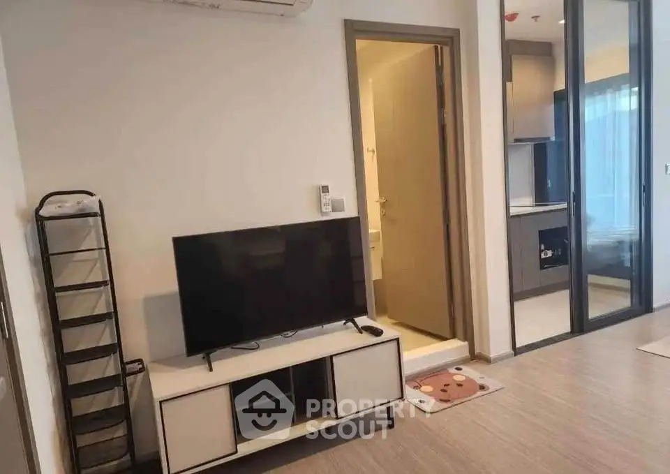 Modern living room with TV and open layout in stylish apartment