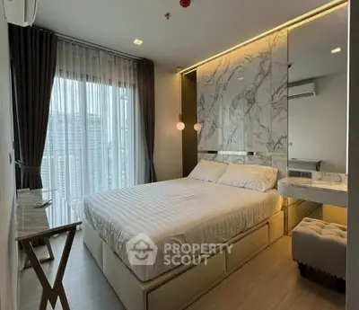 Modern bedroom with marble accent wall and city view