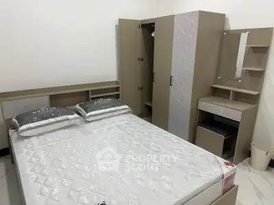 Modern bedroom with stylish furniture and comfortable mattress, perfect for relaxation.