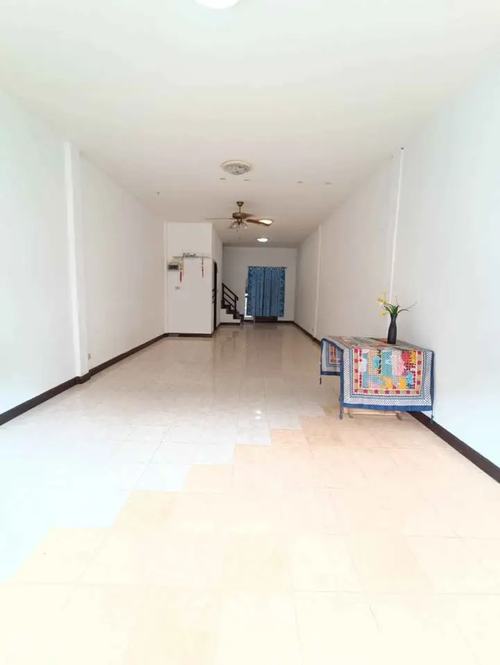 Spacious interior with tiled flooring and minimalist decor, ideal for versatile living space.
