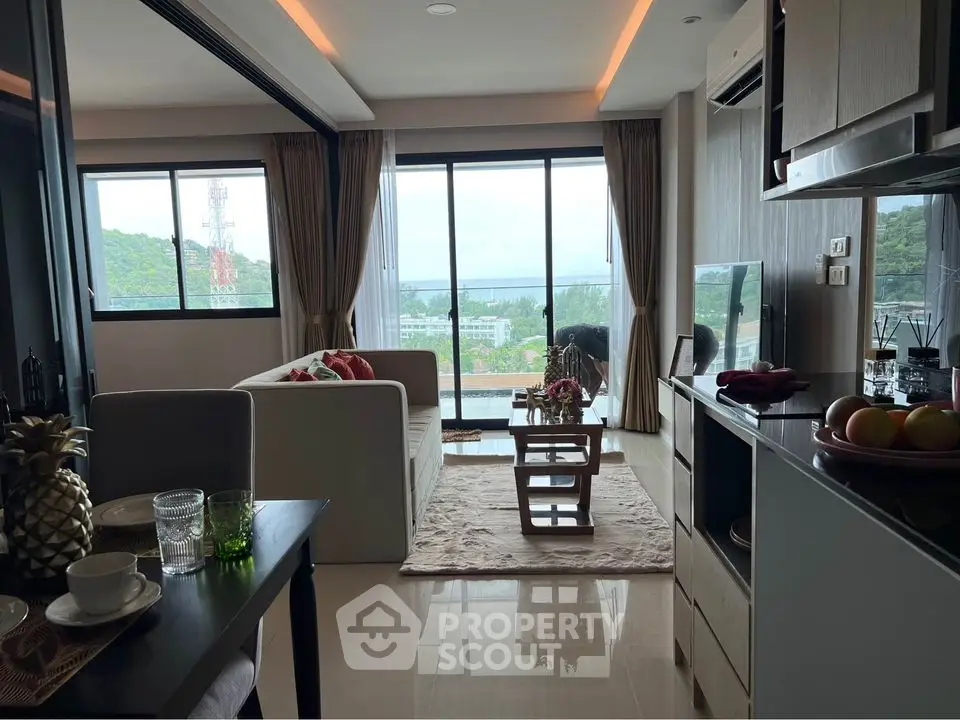 Modern living room with stunning view and open layout, featuring stylish decor and natural light.