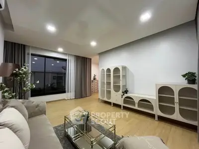 Spacious modern living room with elegant decor and ample natural light