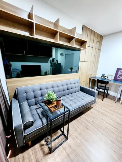 Modern living room with stylish gray sofa and wooden accents