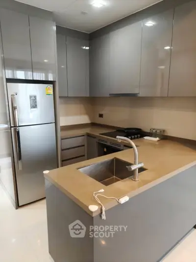 Modern kitchen with sleek cabinetry and stainless steel appliances