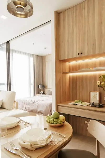 Modern open-plan living and dining area with wooden accents and natural light