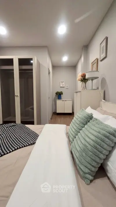Modern bedroom with stylish decor and ample storage space