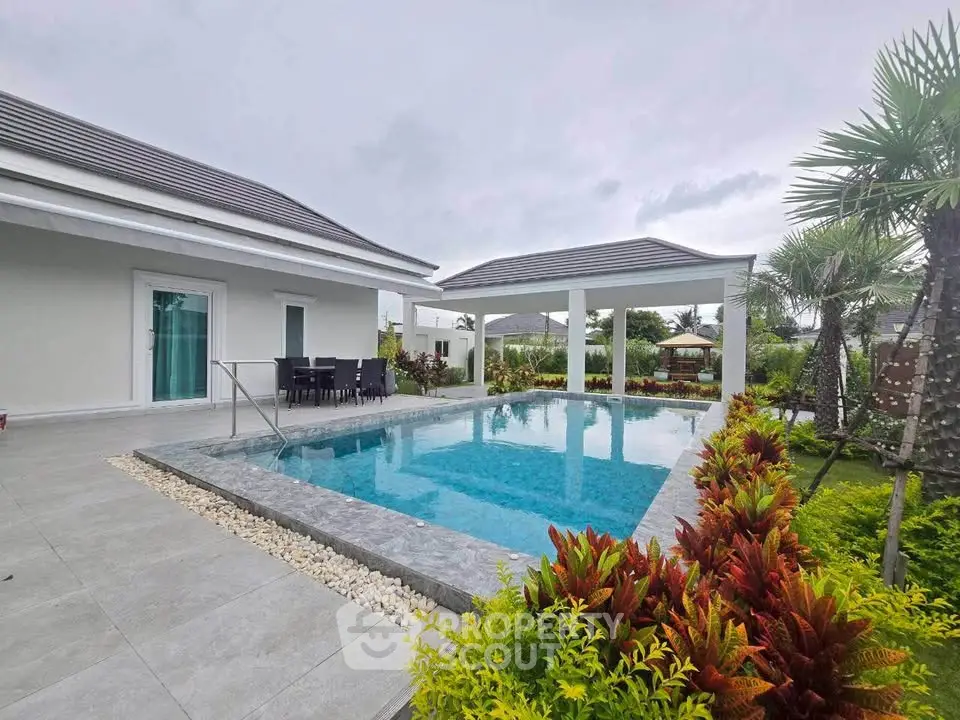 Luxurious villa with private pool and lush garden, perfect for relaxation and entertainment.