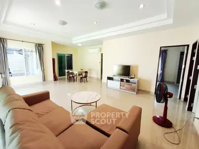 Spacious living room with modern furniture and natural light
