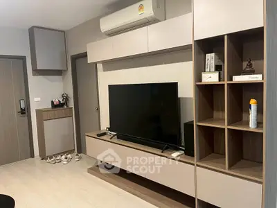 Modern living room with sleek TV unit and stylish shelving