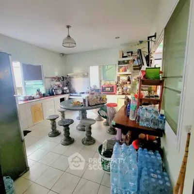 Spacious kitchen with open layout and ample storage, featuring modern appliances and natural light.