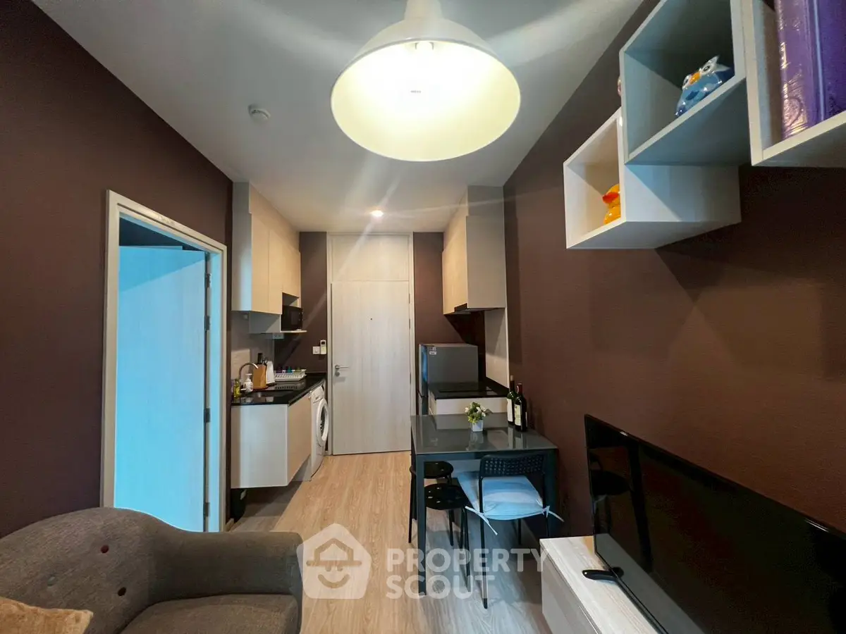 Modern compact living room with integrated kitchen and stylish decor