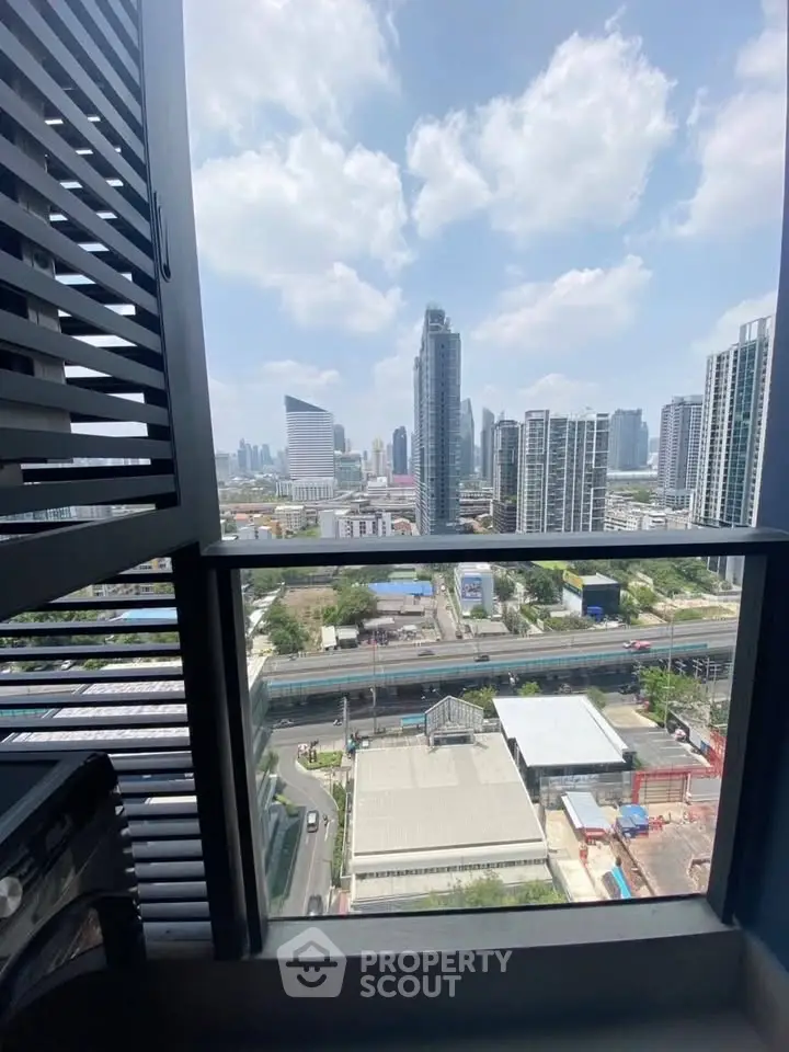 Stunning cityscape view from a high-rise balcony, showcasing modern urban living.