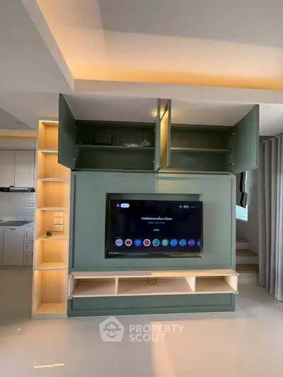 Modern living room with built-in TV unit and stylish lighting