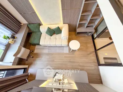 Modern living room with stylish decor and cozy seating area, perfect for relaxation and entertaining.