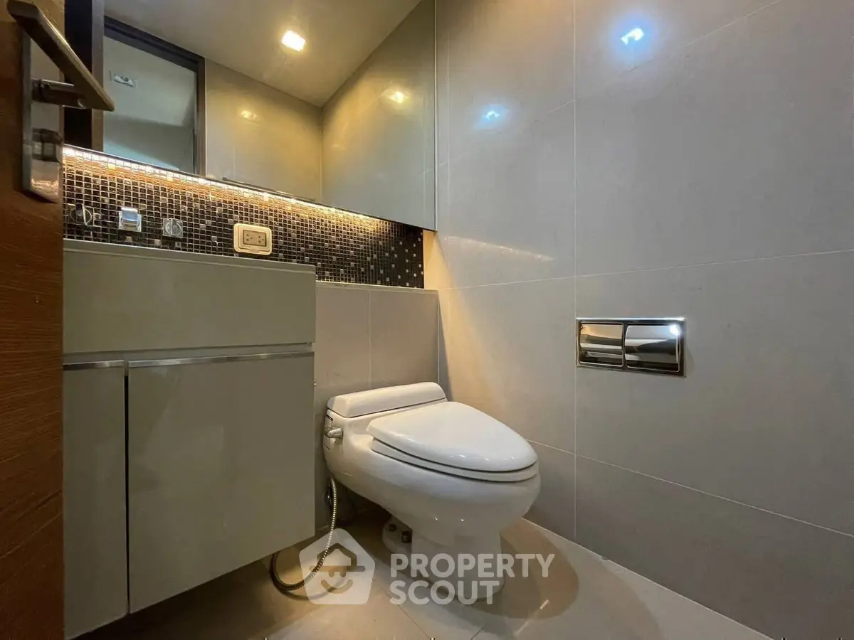 Modern bathroom with sleek design and ambient lighting