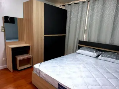 Modern bedroom with stylish wooden furniture and cozy ambiance