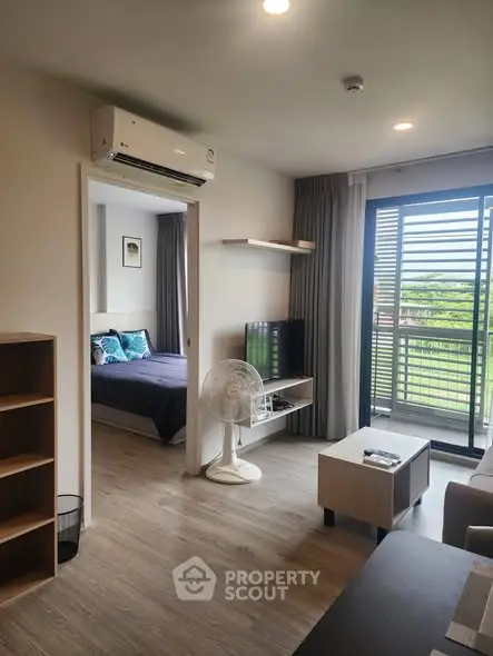 Modern apartment living room with balcony view and stylish decor