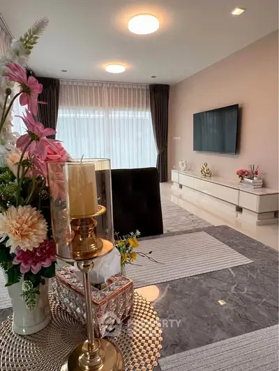 Elegant living room with modern decor and large windows for natural light.