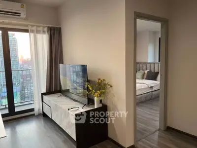 Modern apartment interior with cozy living room and stylish bedroom view, featuring elegant decor and natural light.