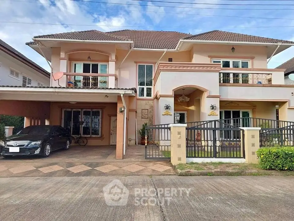 Elegant two-story house with carport and gated entrance in a suburban neighborhood.