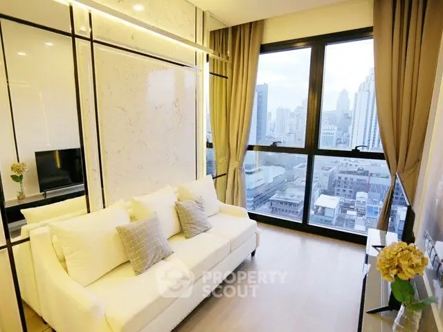 Modern living room with city view, featuring elegant decor and large windows for natural light.