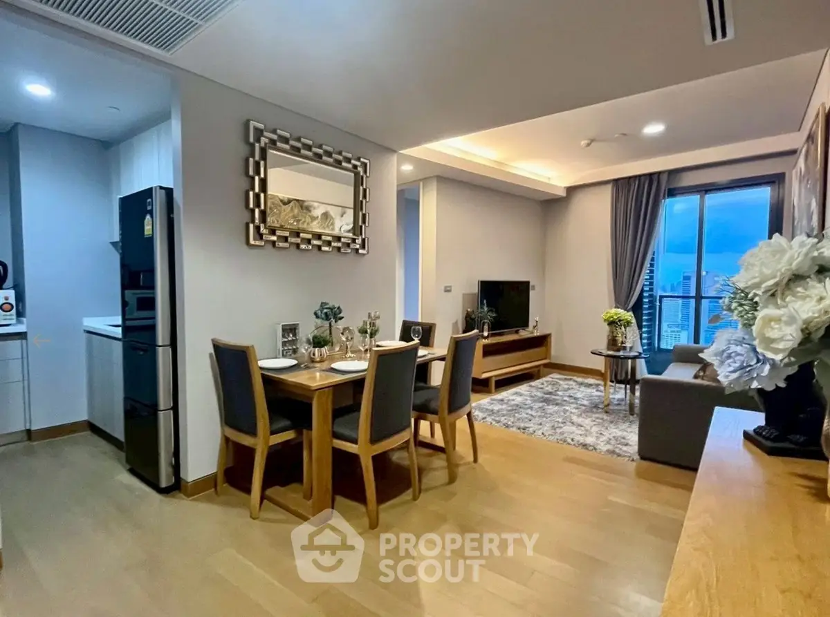 Modern living room with dining area and city view, featuring elegant decor and open layout.