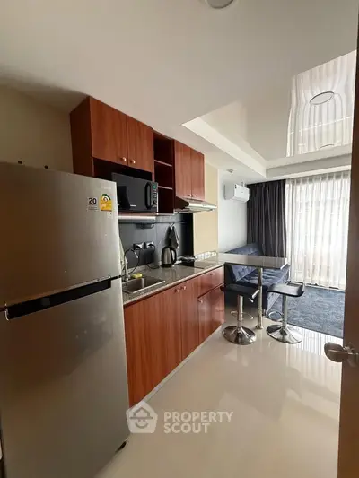 Modern kitchen with dining area and natural light